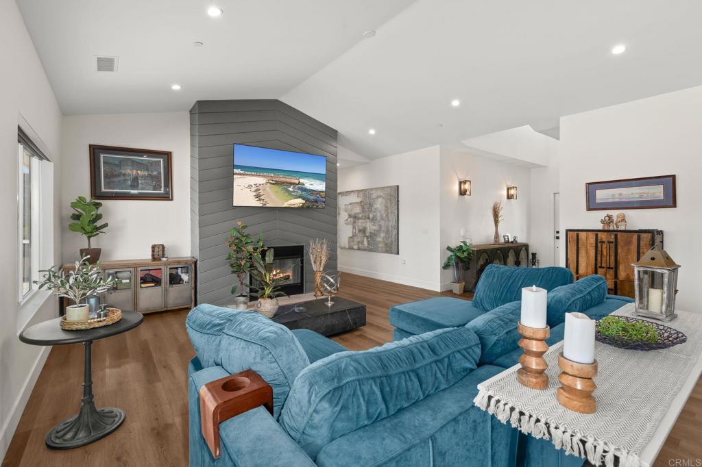 15663 Mathew Road Valley Center, CA 92082 - Photo 6 of 54 a living room with furniture potted plant and a fireplace