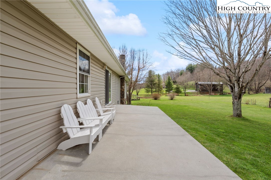 883 Bald Mountain Road West Jefferson, NC 28694 - Photo 31 of 47 a view of a patio with a yard