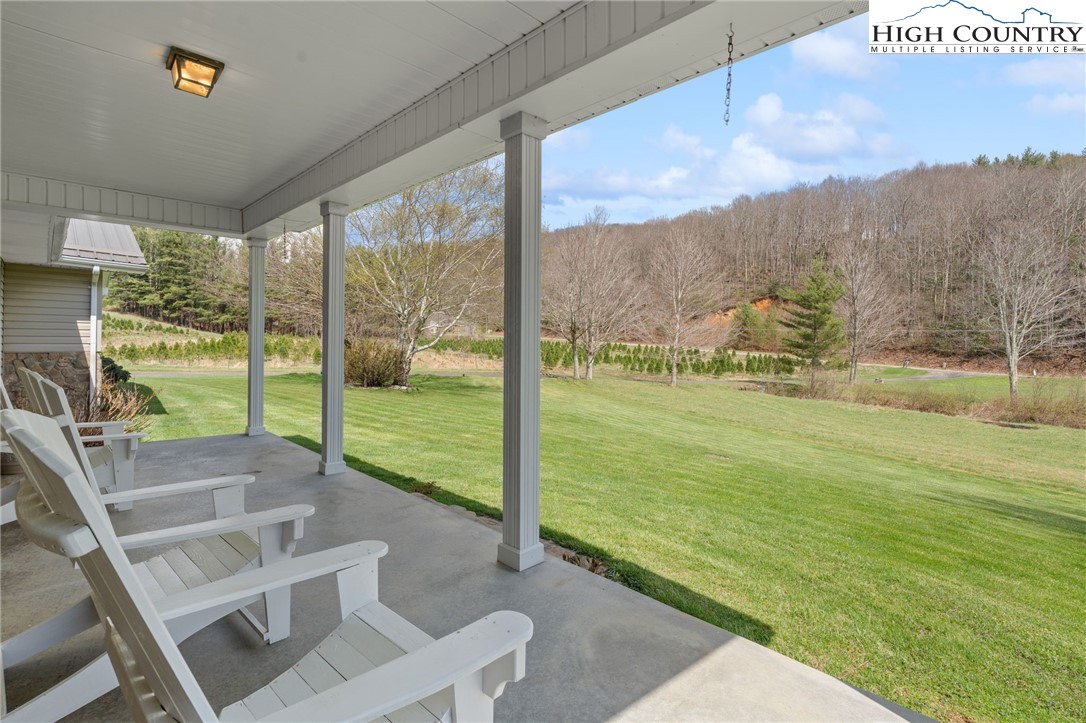 883 Bald Mountain Road West Jefferson, NC 28694 - Photo 41 of 47 a view of a porch with furniture and garden