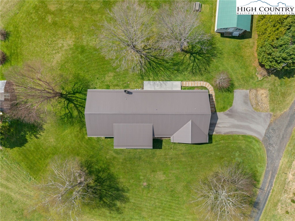 883 Bald Mountain Road West Jefferson, NC 28694 - Photo 45 of 47 aerial view of a house with pool and a yard