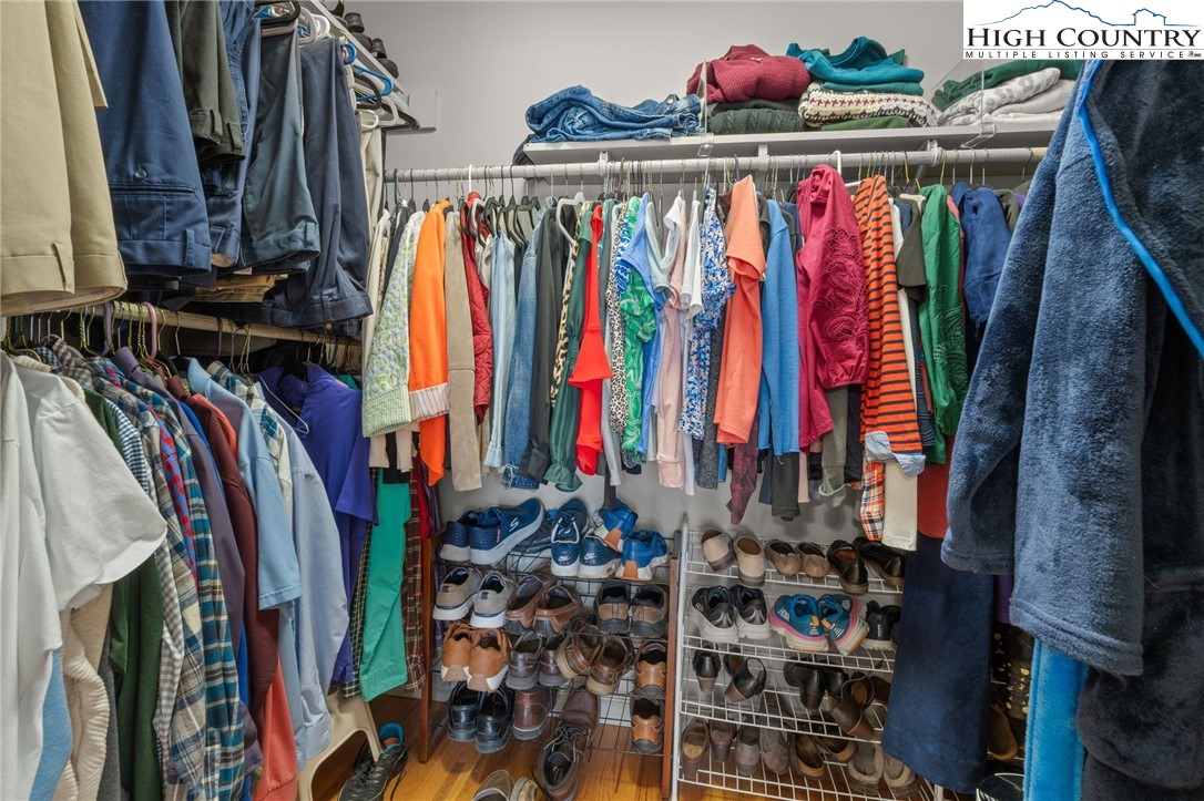 883 Bald Mountain Road West Jefferson, NC 28694 - Photo 10 of 47 a view of walk in closet with clothes