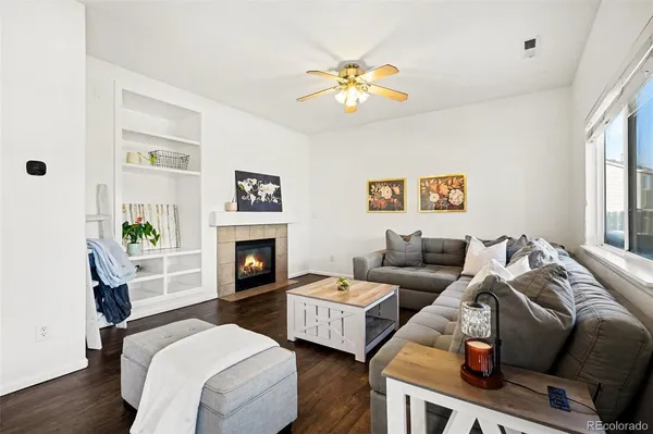 a living room with furniture and a fireplace