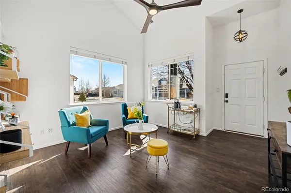a living room with dining room and wooden floor