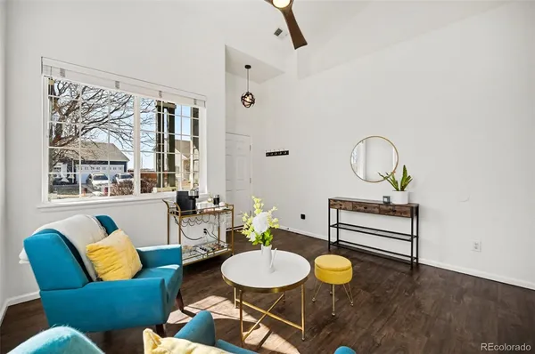 a living room with furniture and a window