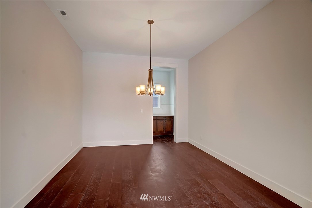 21714 35th Avenue Southeast, Unit 22 Bothell, WA 98021 - Photo 12 of 14 a view of a room with wooden floor and window