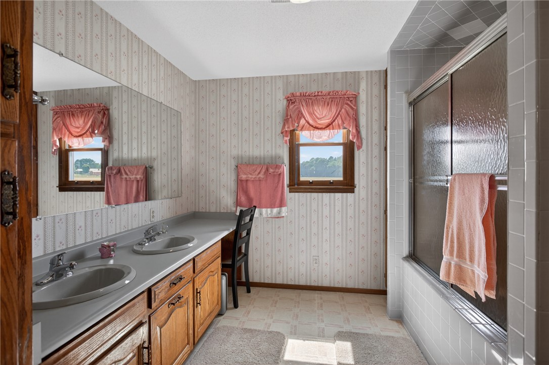 145 State Rd S-4-935 Pendleton, SC 29670 - Photo 17 of 47 Functional bathroom featuring a double vanity and a shower-tub combination.