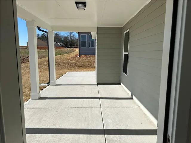 a view of entryway with wooden floor and stairs