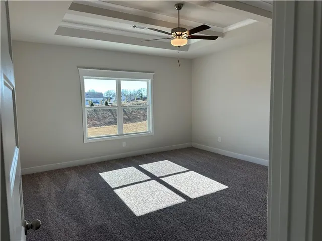 a front view of a house with a yard table and chairs
