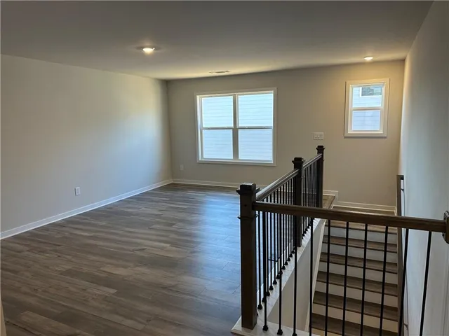 a view of a porch with furniture and garden