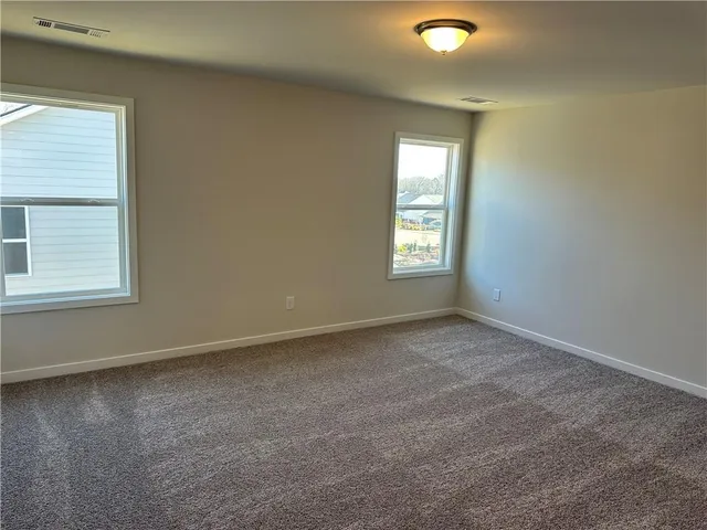 a view of a patio with a table and chairs