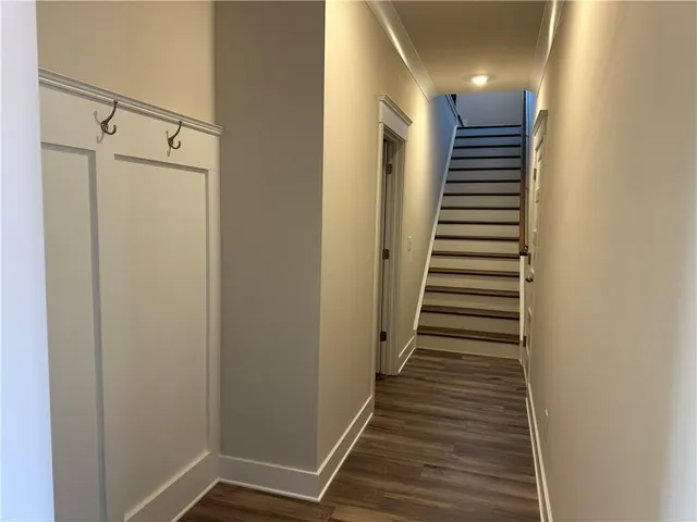 a kitchen with stainless steel appliances granite countertop a sink a oven and a counter space
