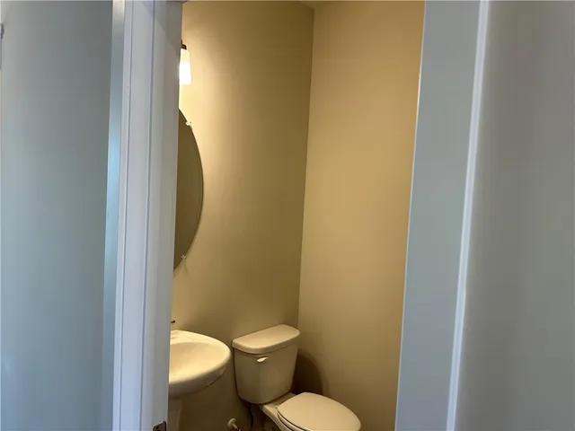 a bathroom with a large mirror and shower