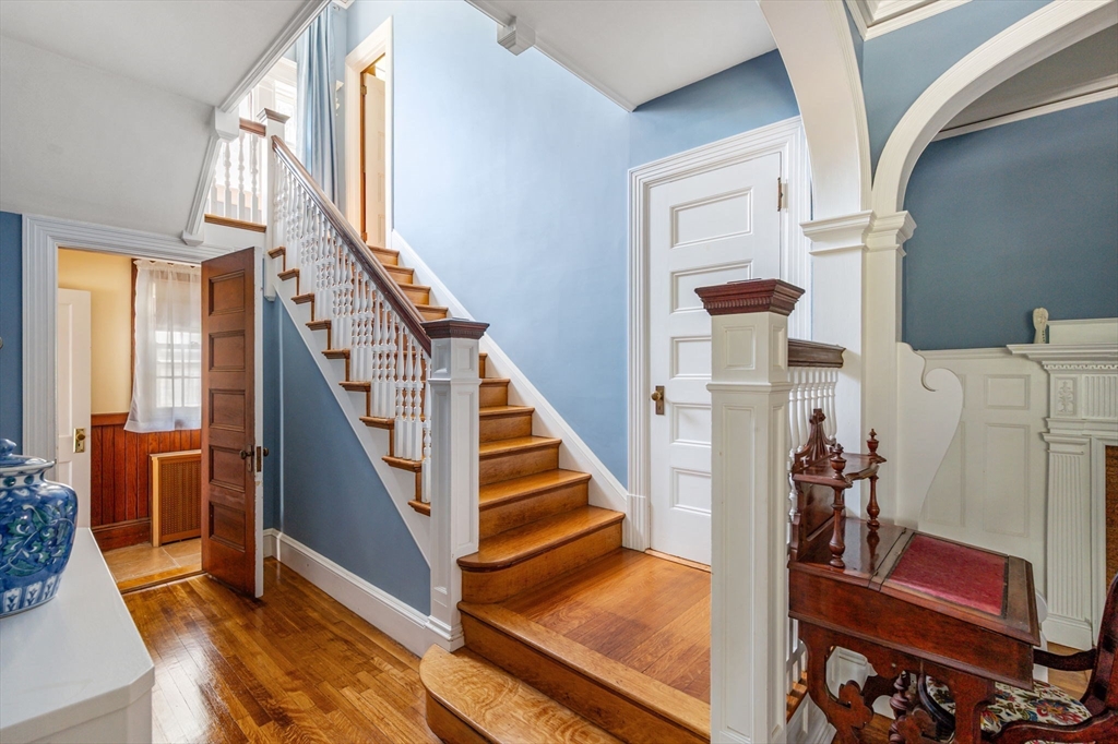 16 Beaumont Street Boston, MA 02124 - Photo 11 of 41 a view of an entryway with wooden floor and stairs