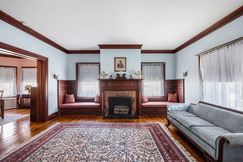 16 Beaumont Street Boston, MA 02124 - Photo 12 of 41 a living room with furniture and a fireplace