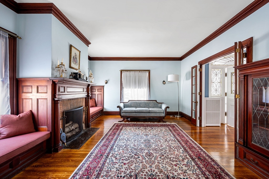 16 Beaumont Street Boston, MA 02124 - Photo 13 of 41 a living room with furniture and a fireplace
