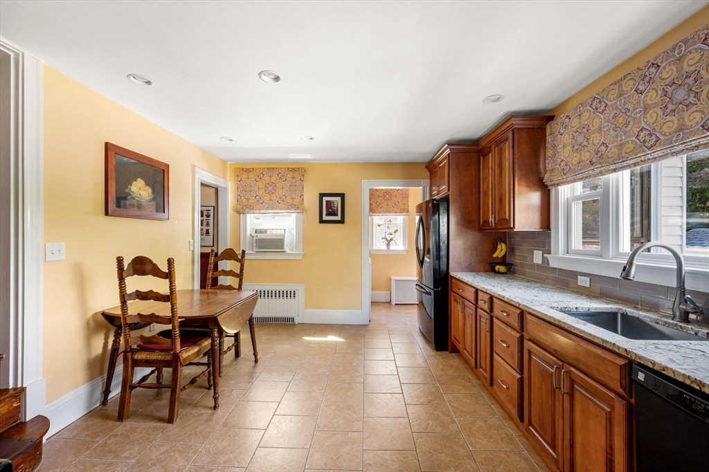 16 Beaumont Street Boston, MA 02124 - Photo 20 of 41 a large kitchen with a large counter top space and stainless steel appliances