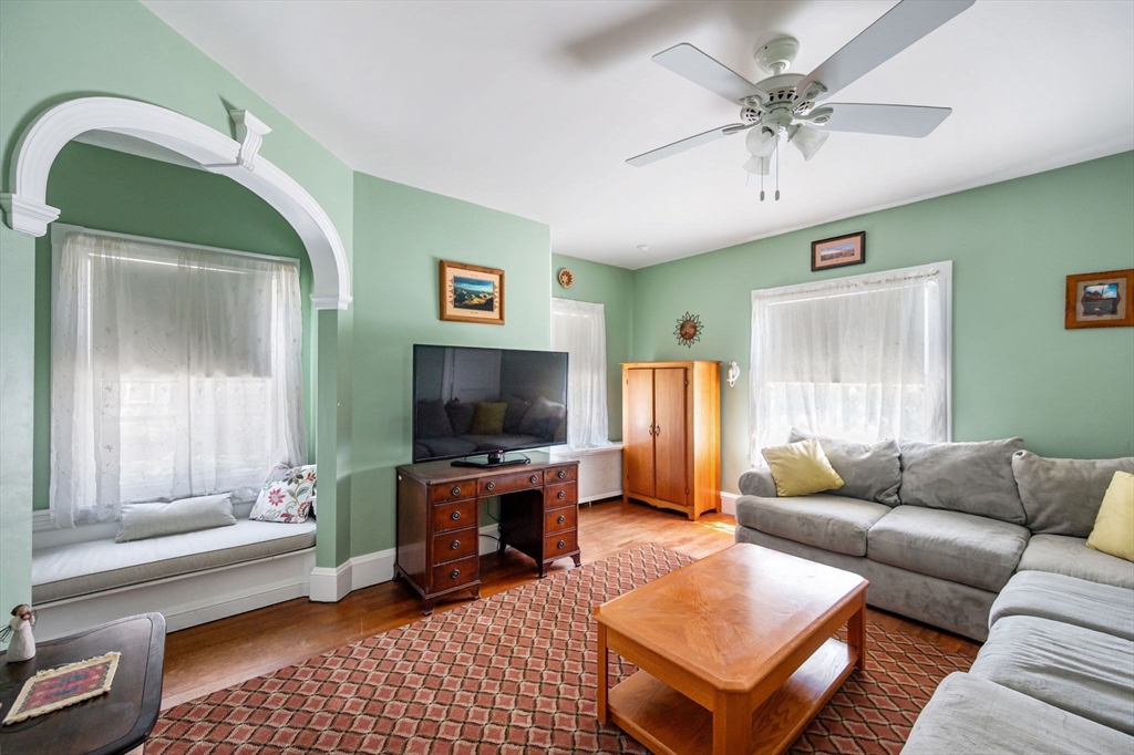16 Beaumont Street Boston, MA 02124 - Photo 26 of 41 a living room with furniture and a flat screen tv