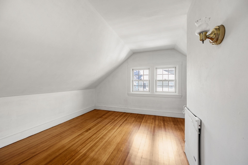 16 Beaumont Street Boston, MA 02124 - Photo 30 of 41 wooden floor in an empty room with a window