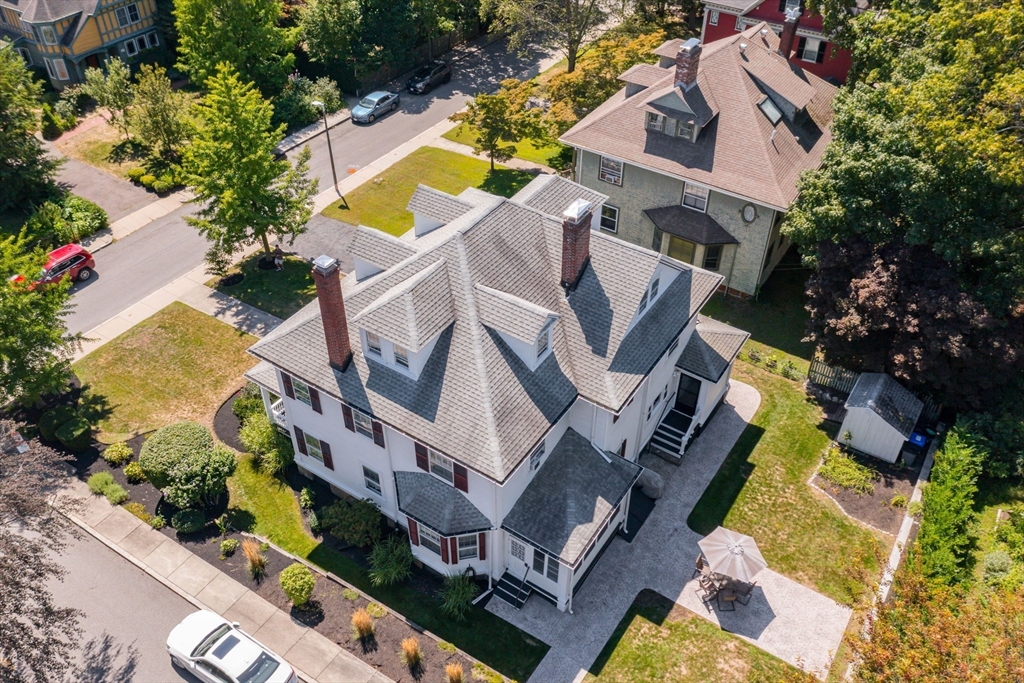 16 Beaumont Street Boston, MA 02124 - Photo 3 of 41 an aerial view of a house with a swimming pool and outdoor space
