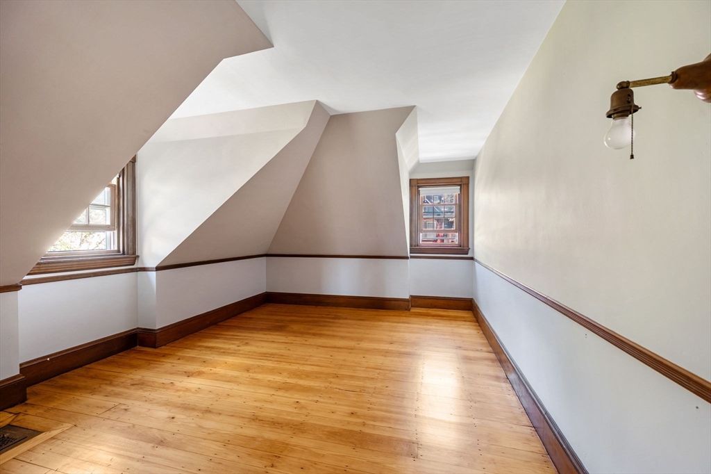 16 Beaumont Street Boston, MA 02124 - Photo 31 of 41 a view of a big room with wooden floor