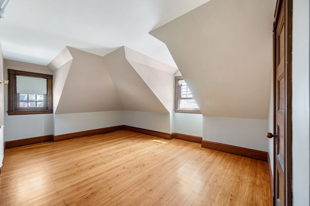 16 Beaumont Street Boston, MA 02124 - Photo 32 of 41 a view of an empty room with wooden floor and a window