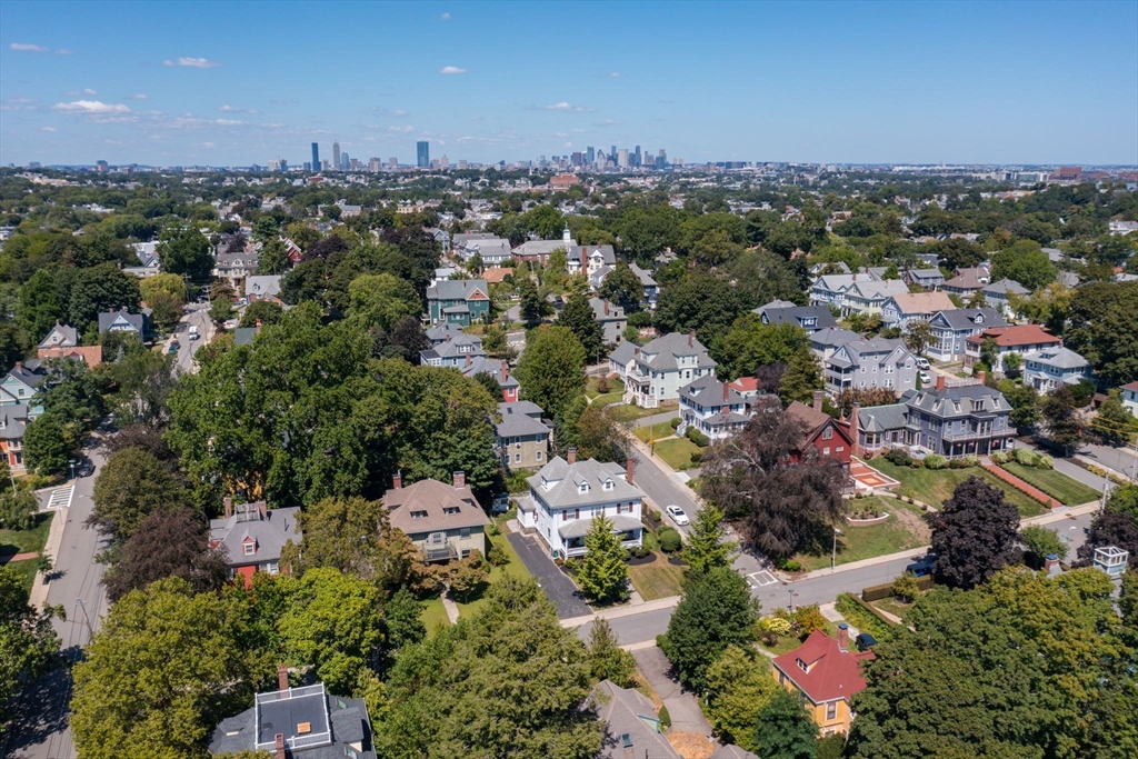16 Beaumont Street Boston, MA 02124 - Photo 39 of 41 an aerial view of residential houses with outdoor space and trees