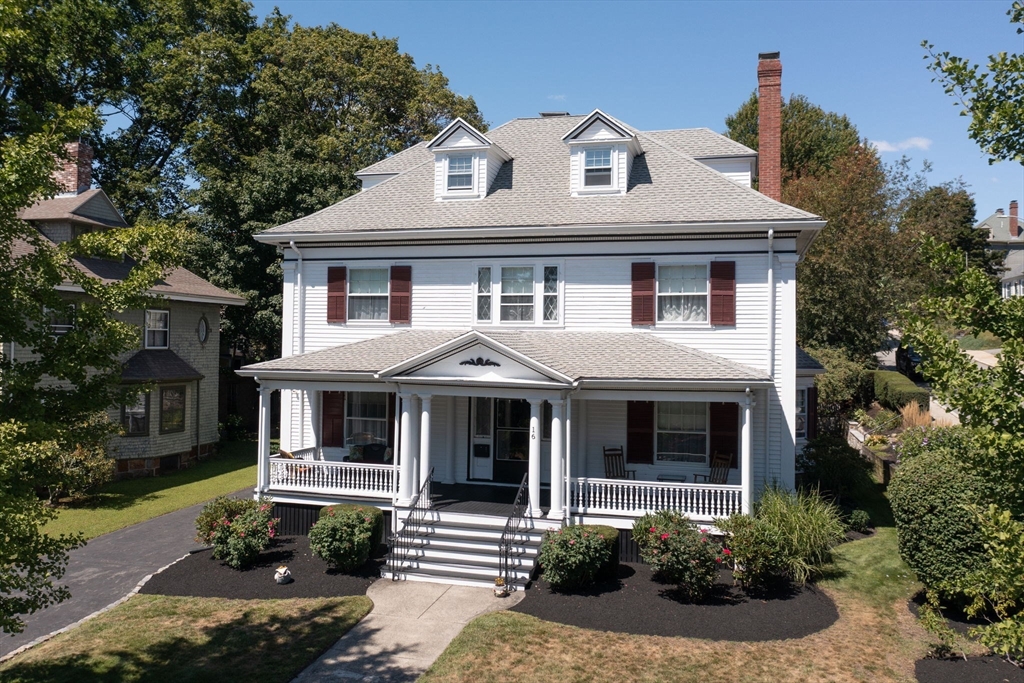 16 Beaumont Street Boston, MA 02124 - Photo 4 of 41 a front view of a house with a yard