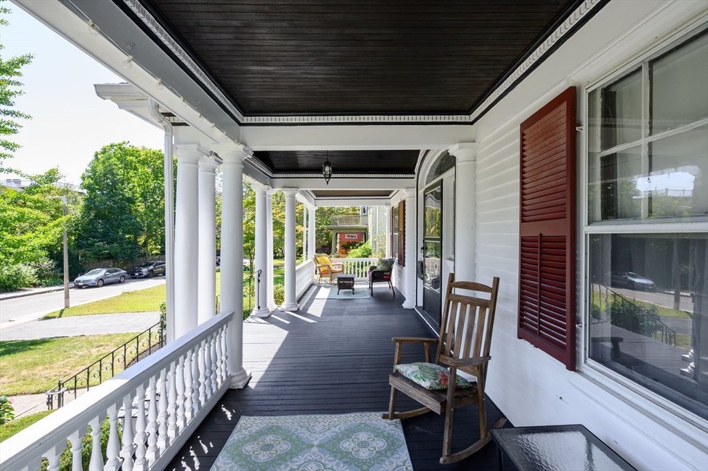 16 Beaumont Street Boston, MA 02124 - Photo 5 of 41 a view of a porch with furniture and floor to ceiling window