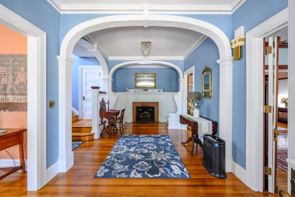 16 Beaumont Street Boston, MA 02124 - Photo 8 of 41 a living room with fireplace furniture and a fireplace