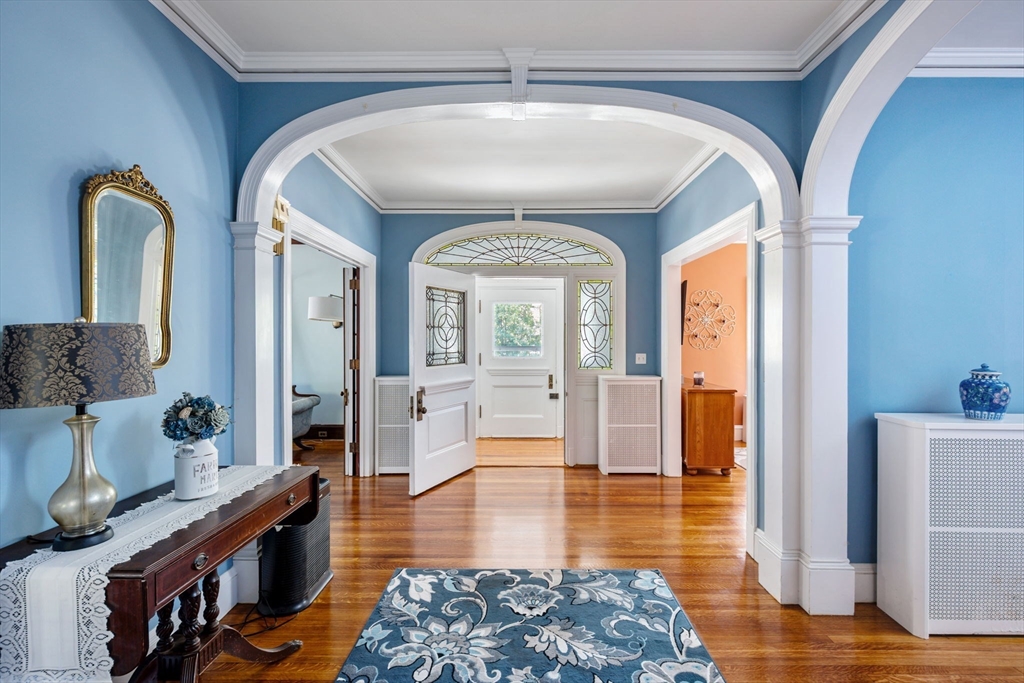 16 Beaumont Street Boston, MA 02124 - Photo 9 of 41 a living room with furniture and a wooden floor