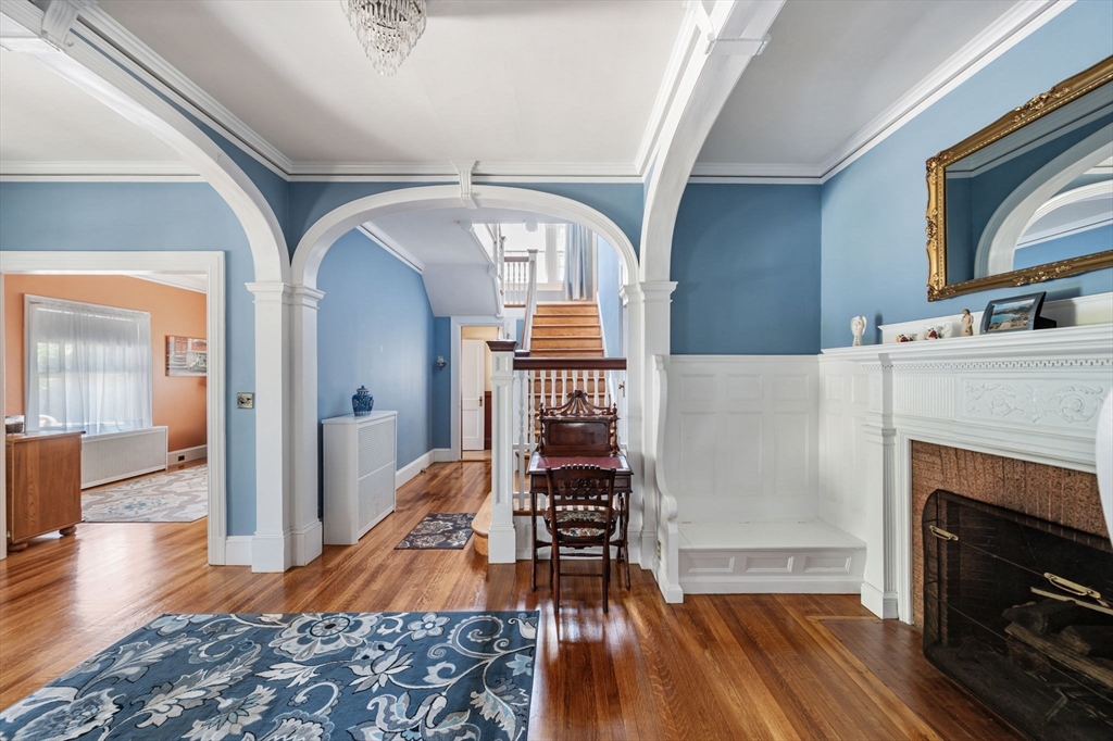 16 Beaumont Street Boston, MA 02124 - Photo 10 of 41 a living room with furniture fireplace and wooden floor