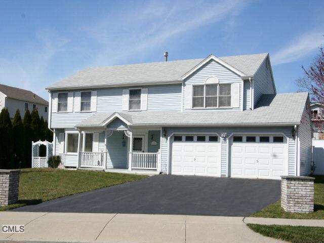 127 Settlers Ridge Road Milford, CT 06460 - Photo 1 of 1 a front view of a house with a yard and garage