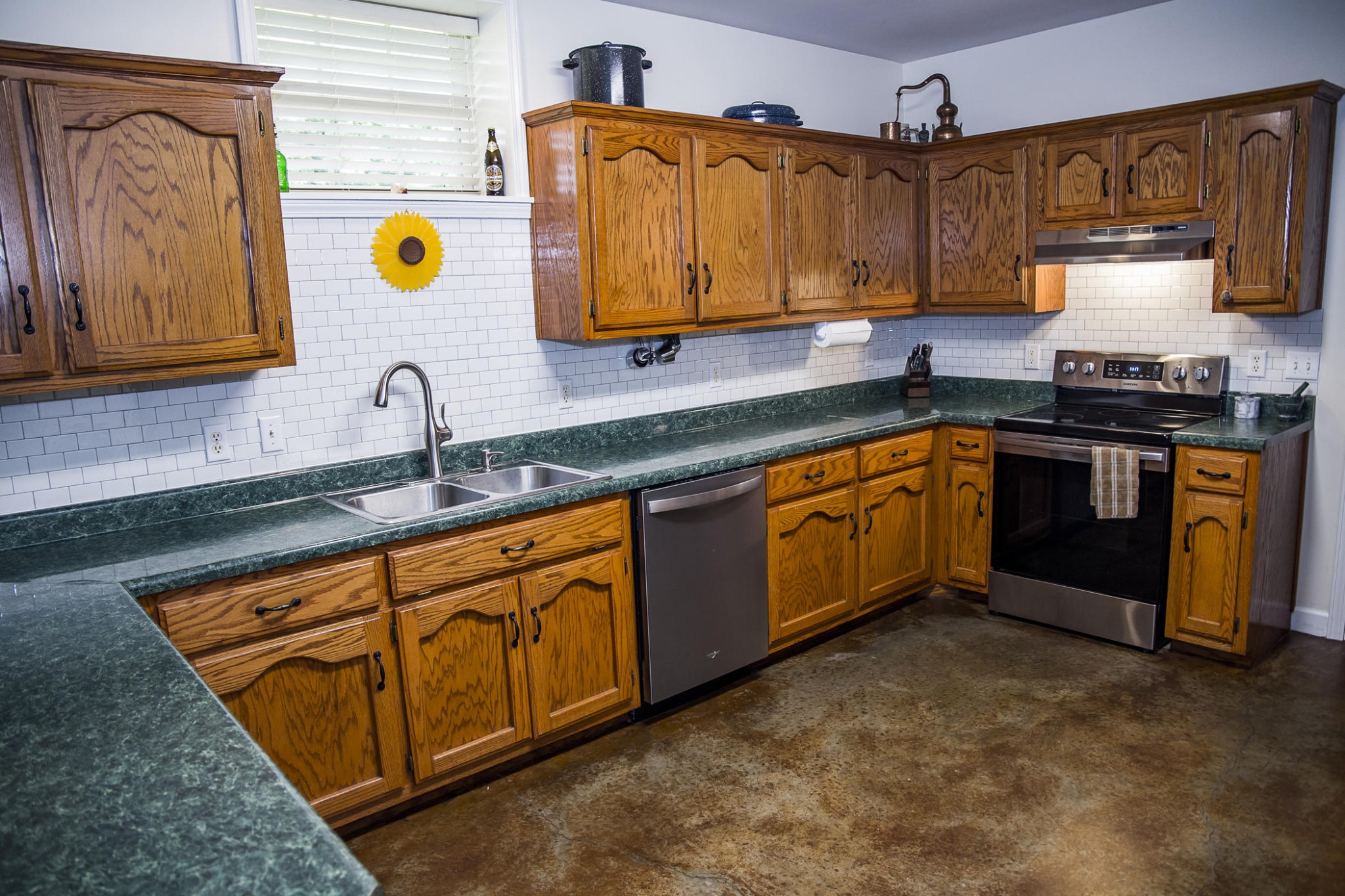 5520 Academy Road Cookeville, TN 38506 - Photo 13 of 40 a kitchen with stainless steel appliances granite countertop a sink and stove