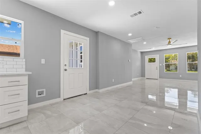 a view of an empty room with a window