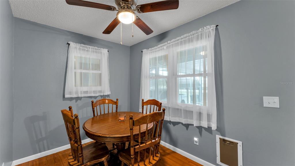 13700 Pine Meadow Road Kathleen, FL 33849 - Photo 14 of 39 a view of a dining room with furniture window and outside view