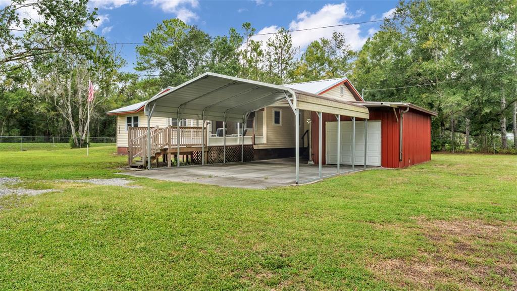 13700 Pine Meadow Road Kathleen, FL 33849 - Photo 30 of 39 a house view with a garden space