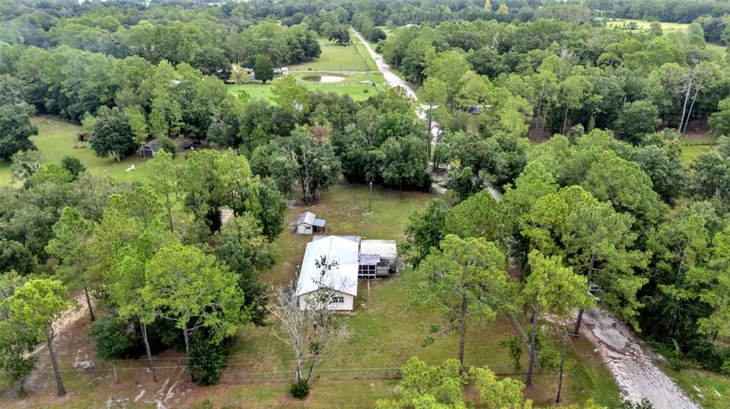 13700 Pine Meadow Road Kathleen, FL 33849 - Photo 3 of 39 an aerial view of a house with a yard