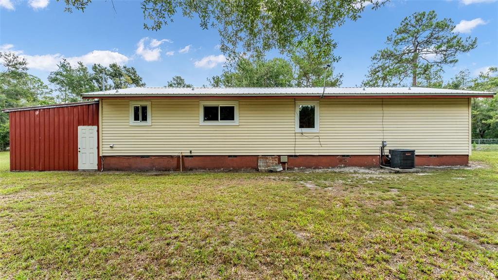 13700 Pine Meadow Road Kathleen, FL 33849 - Photo 34 of 39 a backyard of a house