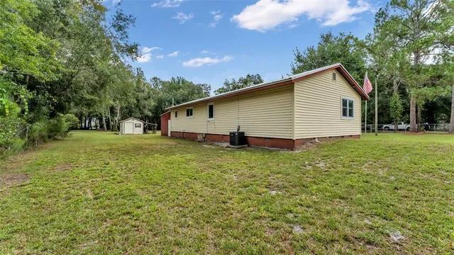 a view of a backyard of the house