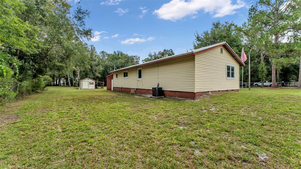 13700 Pine Meadow Road Kathleen, FL 33849 - Photo 35 of 39 a view of a backyard of the house