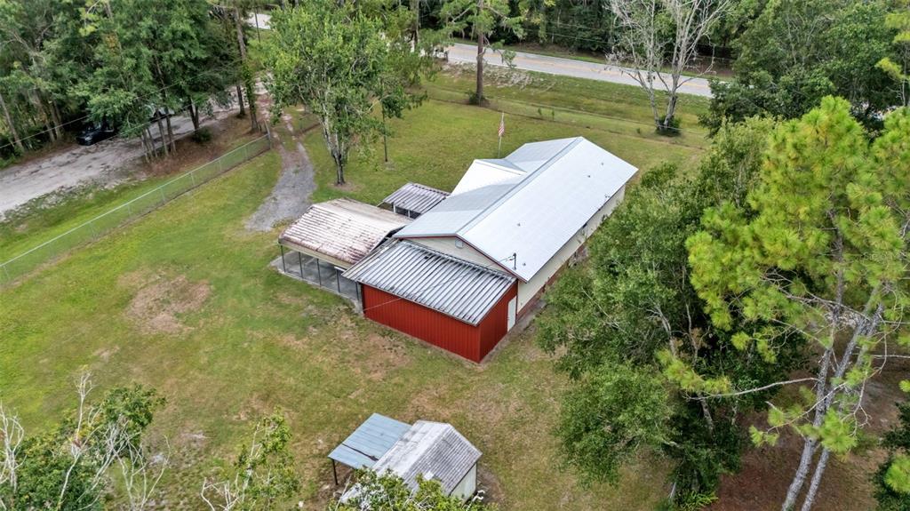 13700 Pine Meadow Road Kathleen, FL 33849 - Photo 6 of 39 swimming view of a garden with a bench