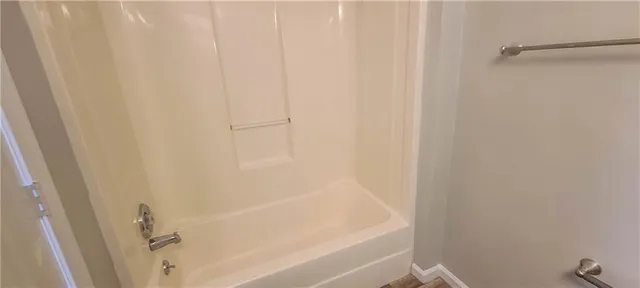 a close view of a bathtub in bathroom