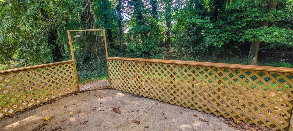 2120 Fairways Court Kennesaw, GA 30144 - Photo 20 of 20 a view of a pathway gate with wooden fence