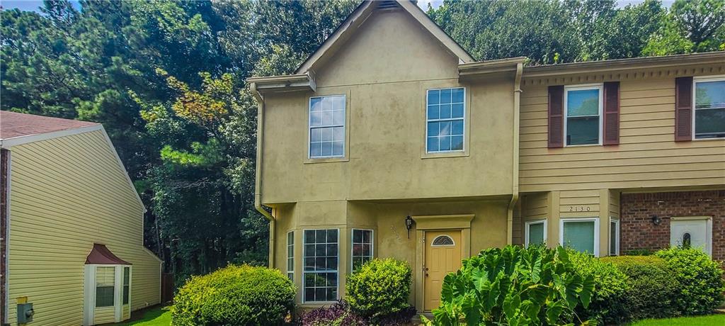 2120 Fairways Court Kennesaw, GA 30144 - Photo 2 of 20 a view of a white house next to a yard