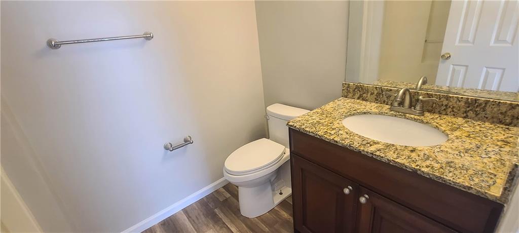 2120 Fairways Court Kennesaw, GA 30144 - Photo 10 of 20 a bathroom with a granite countertop sink and a toilet