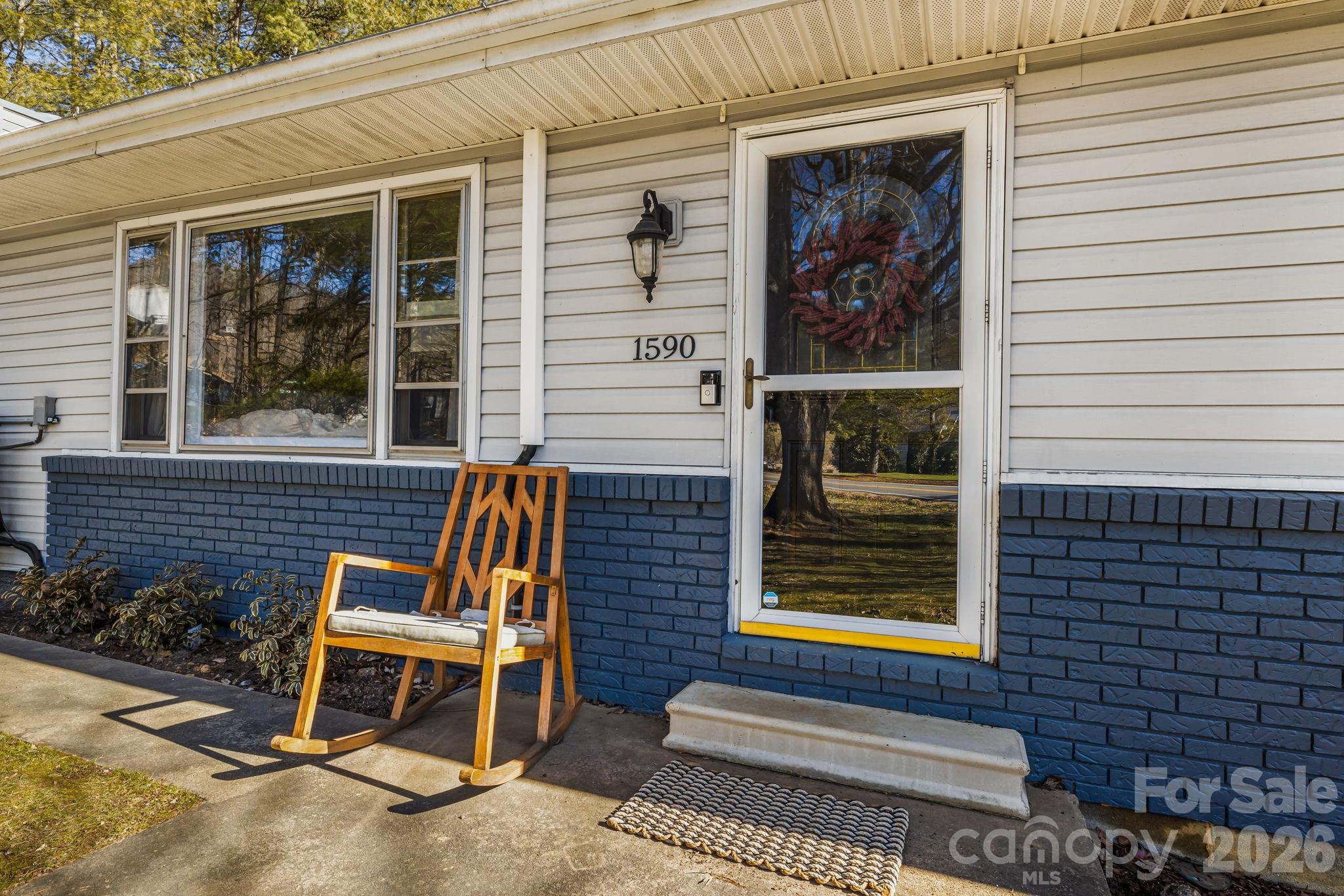 a view of a two chairs in the porch