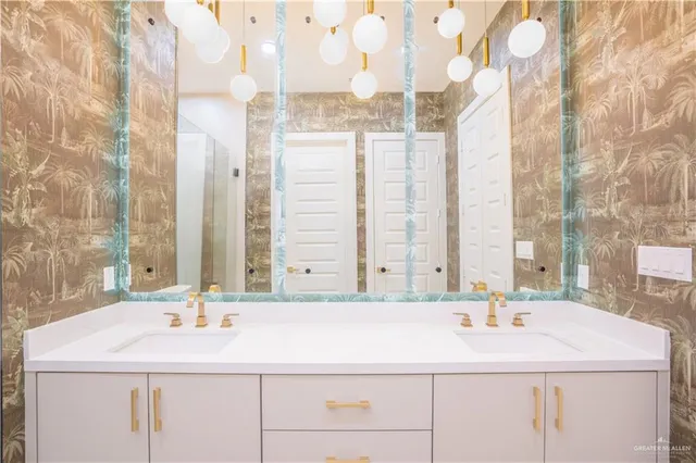a bathroom with a sink and a mirror