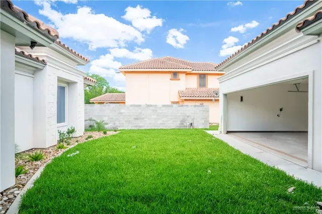 a view of a back yard of the house