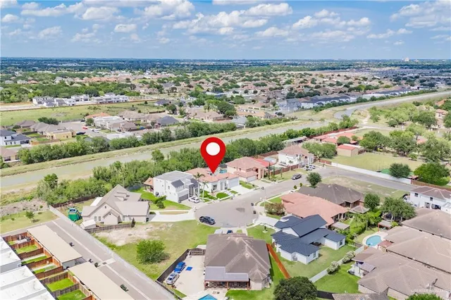 an aerial view of residential houses with outdoor space
