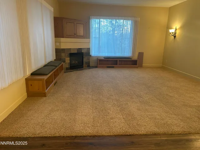 a kitchen with stainless steel appliances a sink cabinets and wooden floor